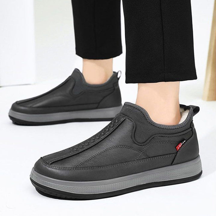 Gefütterte Herren-Schneestiefel mit flacher Sohle und runder Spitze