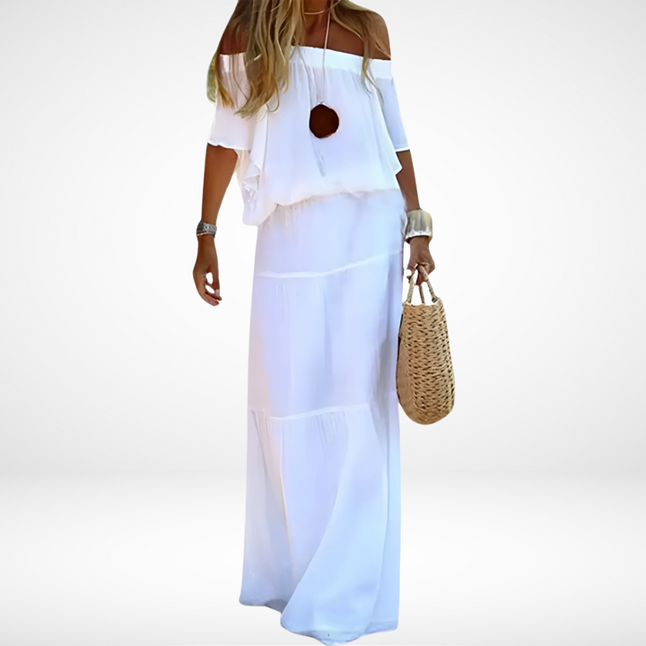 Elegantes weißes schulterfreies Maxikleid für den Strand