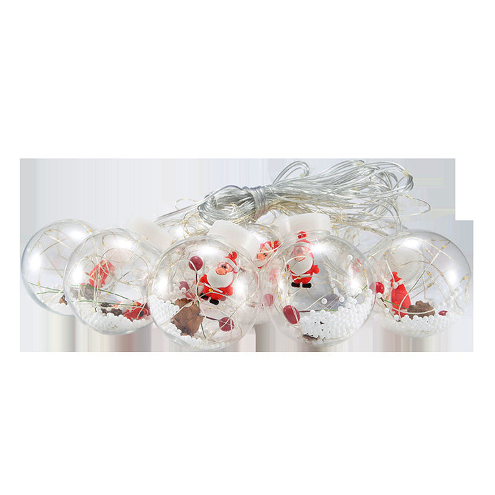 Lichtervorhang mit Weihnachtskugeln und Weihnachtsfiguren
