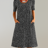 Blumiges Midikleid mit hoher Taille und Taschen